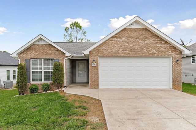 1643 Bobby Nichols Dr, Cookeville, TN 38506 - ranch-style house featuring central air condition unit, brick siding, driveway, and a front yard