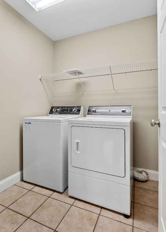 1643 Bobby Nichols Dr, Cookeville, TN 38506 - laundry area featuring washing machine and dryer, baseboards, and light tile patterned floors
