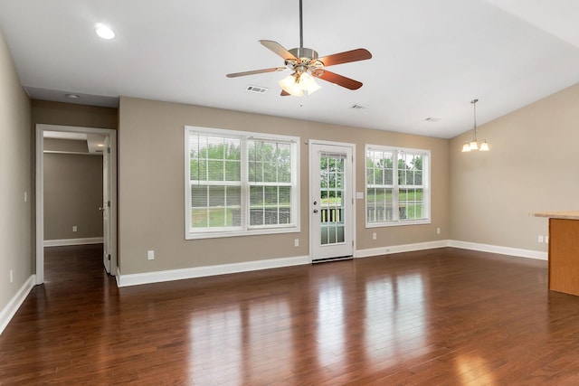 1643 Bobby Nichols Dr, Cookeville, TN 38506 - unfurnished living room featuring ceiling fan, a chandelier, lofted ceiling, dark wood-style flooring, and baseboards