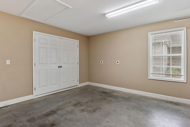 1643 Bobby Nichols Dr, Cookeville, TN 38506 - unfurnished bedroom featuring unfinished concrete flooring, baseboards, and a closet