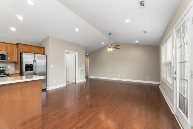 1643 Bobby Nichols Dr, Cookeville, TN 38506 - kitchen with appliances with stainless steel finishes, a ceiling fan, brown cabinets, light countertops, and lofted ceiling