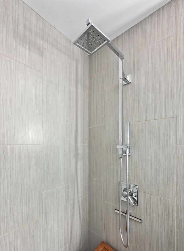 full bathroom with tiled shower