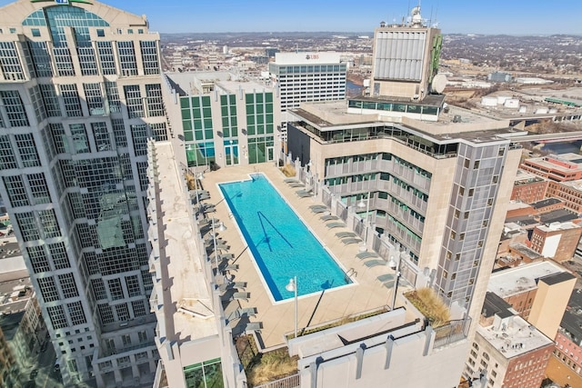 view of pool with a view of city