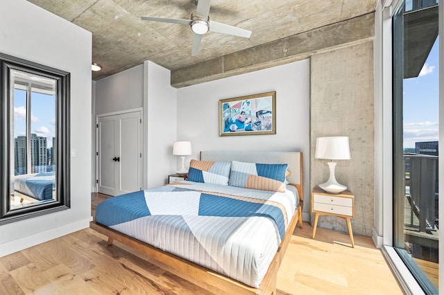 bedroom with wood finished floors and ceiling fan