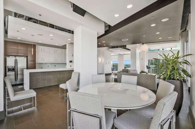 dining space with recessed lighting