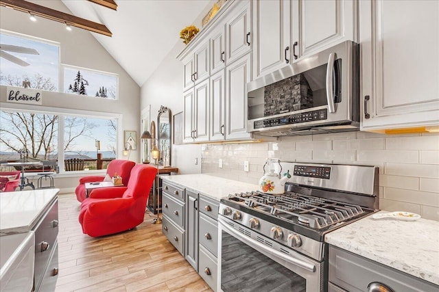 510 Lookout View Dr Unit Rb-177, Jasper, TN 37347 - kitchen featuring appliances with stainless steel finishes, gray cabinetry, beam ceiling, light wood-style flooring, and backsplash
