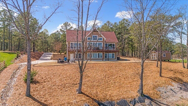 510 Lookout View Dr Unit Rb-177, Jasper, TN 37347 - view of front of house with an outdoor structure, a patio area, a wooden deck, and a storage shed