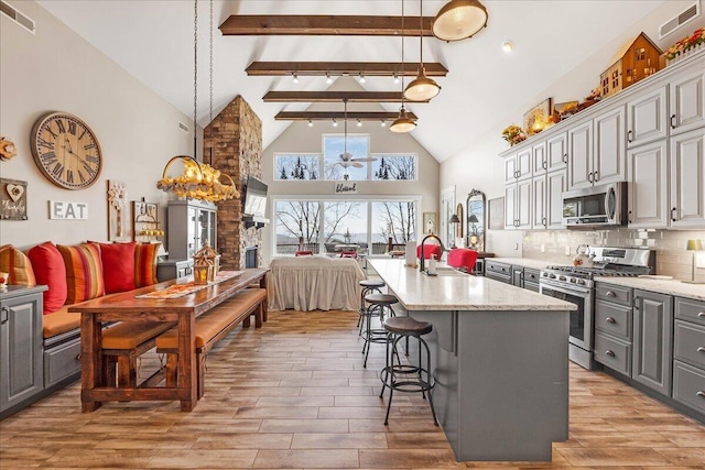 510 Lookout View Dr Unit Rb-177, Jasper, TN 37347 - kitchen featuring appliances with stainless steel finishes, open floor plan, beamed ceiling, high vaulted ceiling, and gray cabinetry