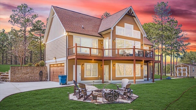 510 Lookout View Dr Unit Rb-177, Jasper, TN 37347 - back of house featuring a storage shed, driveway, a yard, an attached garage, and a fire pit
