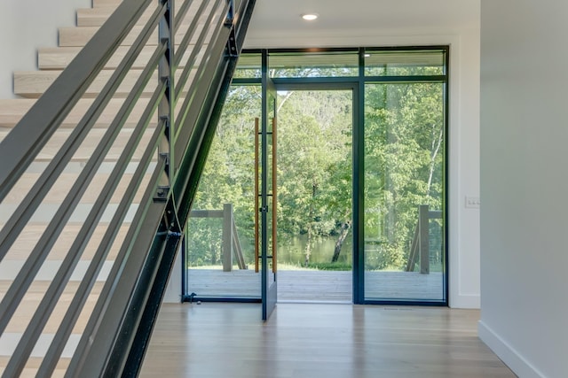 84 Judd Ln, Lancaster, TN 38569 - doorway to outside featuring wood finished floors, baseboards, and a wall of windows
