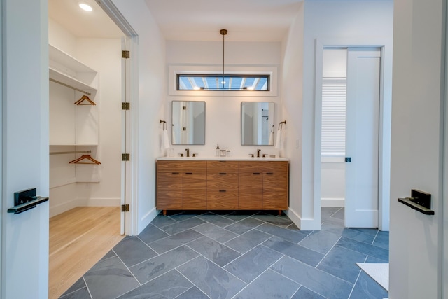 84 Judd Ln, Lancaster, TN 38569 - full bathroom featuring baseboards, double vanity, and a walk in closet