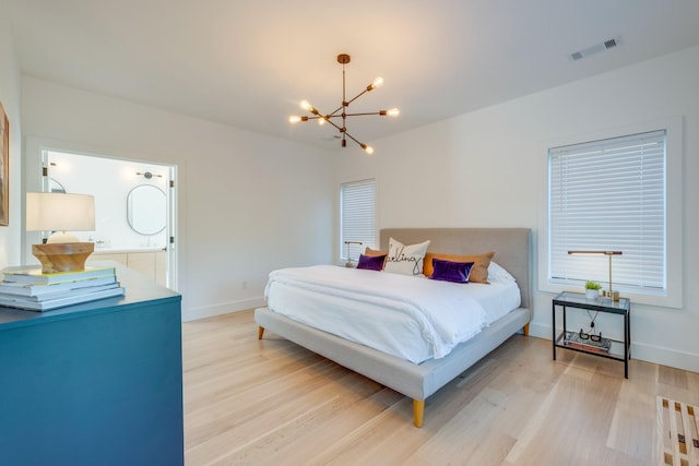 84 Judd Ln, Lancaster, TN 38569 - bedroom featuring light wood finished floors, a chandelier, and baseboards
