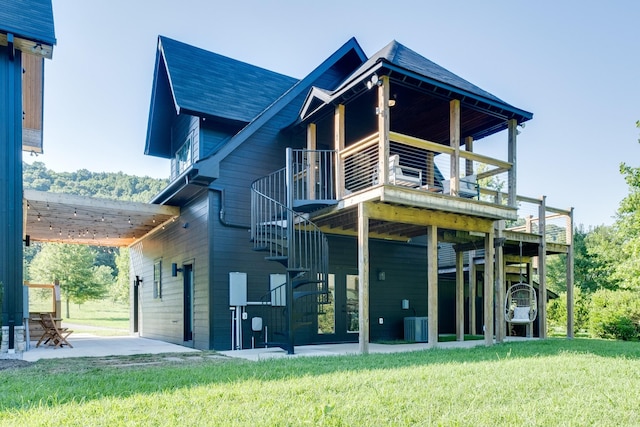 84 Judd Ln, Lancaster, TN 38569 - back of house featuring a yard, stairway, a wooden deck, a shingled roof, and central AC unit
