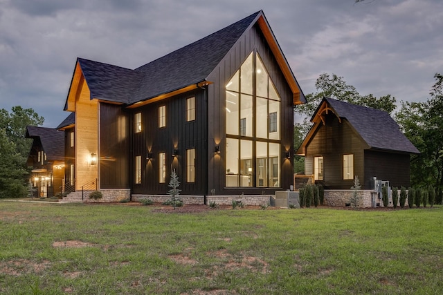 84 Judd Ln, Lancaster, TN 38569 - view of side of home with board and batten siding, roof with shingles, and a lawn