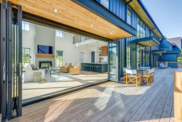 84 Judd Ln, Lancaster, TN 38569 - wooden terrace featuring an outdoor living space with a fireplace and outdoor dining area