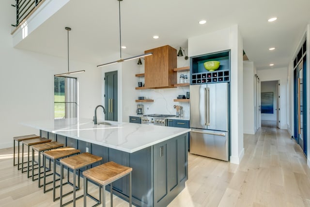 84 Judd Ln, Lancaster, TN 38569 - kitchen featuring stainless steel appliances, open shelves, a sink, light wood-style flooring, and recessed lighting