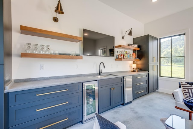 84 Judd Ln, Lancaster, TN 38569 - kitchen with open shelves, a sink, beverage cooler, and healthy amount of natural light