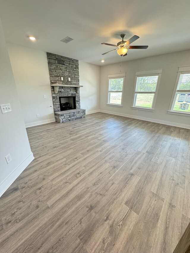 7639 Rookers Bend Dr, Smyrna, TN 37167 - unfurnished living room with wood finished floors, a fireplace, ceiling fan, and baseboards