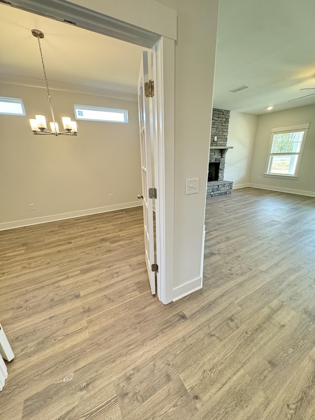 7639 Rookers Bend Dr, Smyrna, TN 37167 - corridor with a chandelier, wood finished floors, and baseboards