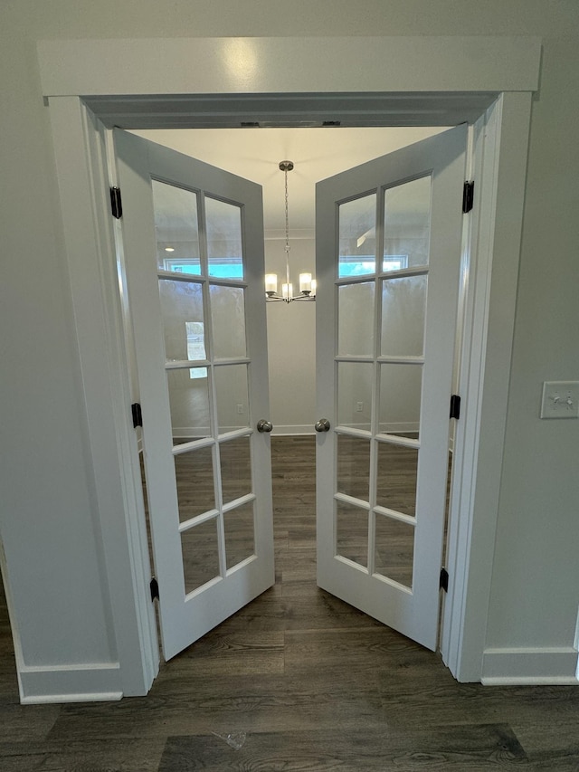 7639 Rookers Bend Dr, Smyrna, TN 37167 - doorway with dark wood-type flooring, a chandelier, and baseboards