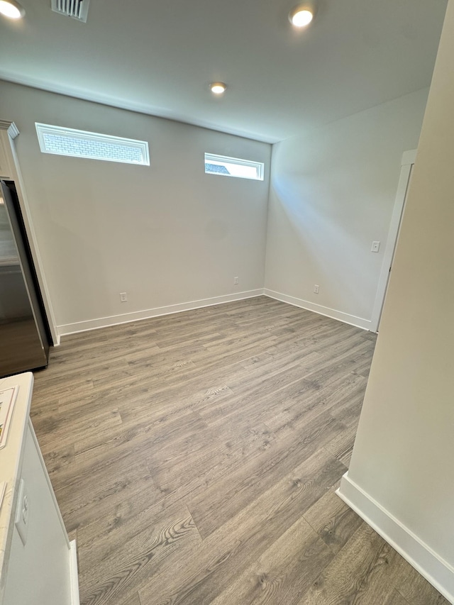 7639 Rookers Bend Dr, Smyrna, TN 37167 - below grade area with wood finished floors, baseboards, and recessed lighting