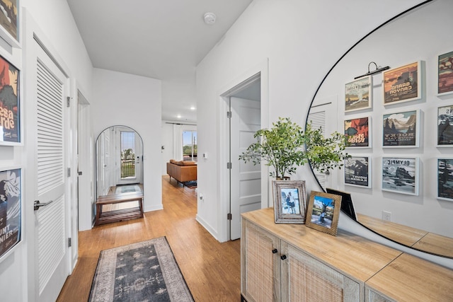 hallway with light wood-style floors