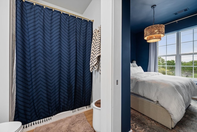 bedroom with wood finished floors