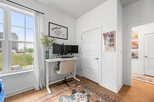 office area featuring wood finished floors and baseboards