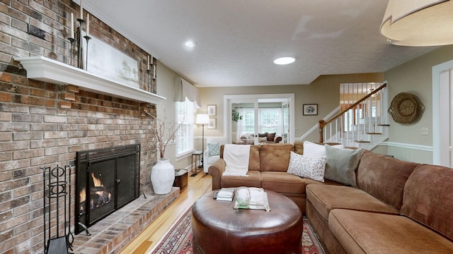 152 Bluegrass Dr, Hendersonville, TN 37075 - living area with wood finished floors, a fireplace, stairs, and recessed lighting