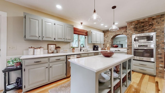 152 Bluegrass Dr, Hendersonville, TN 37075 - kitchen featuring appliances with stainless steel finishes, a sink, light wood-type flooring, light countertops, and recessed lighting