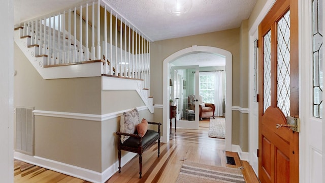 152 Bluegrass Dr, Hendersonville, TN 37075 - foyer entrance with wood finished floors, arched walkways, stairway, baseboards, and a textured ceiling
