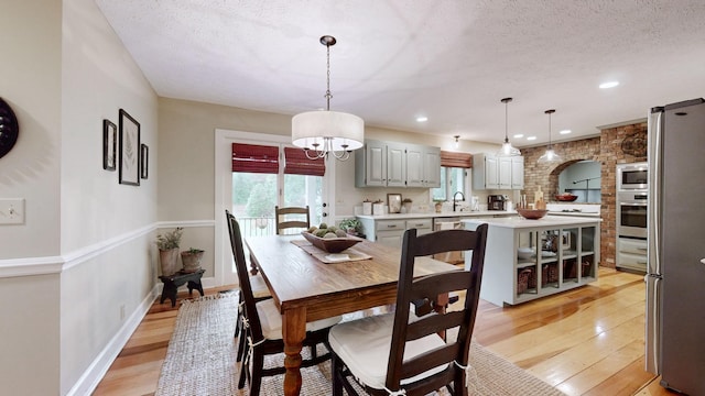 152 Bluegrass Dr, Hendersonville, TN 37075 - dining area featuring light wood-style floors, a textured ceiling, recessed lighting, and baseboards