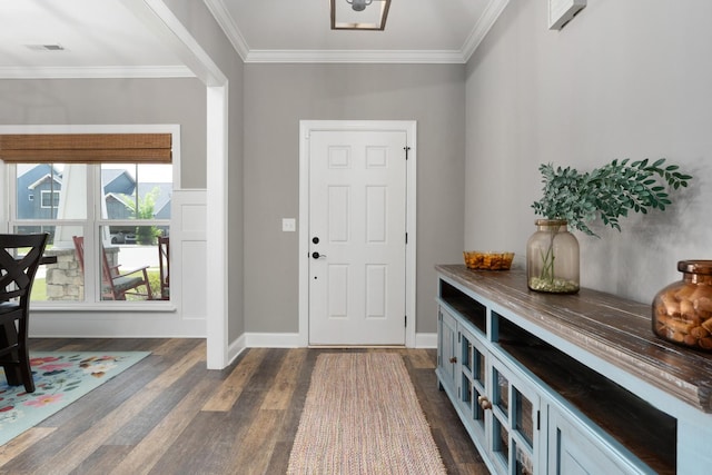 entryway with dark wood-style flooring, crown molding, and baseboards