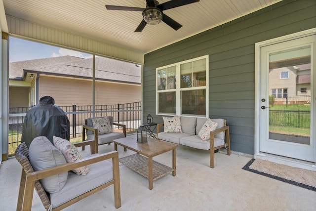 view of patio / terrace with an outdoor hangout area, fence, and a ceiling fan