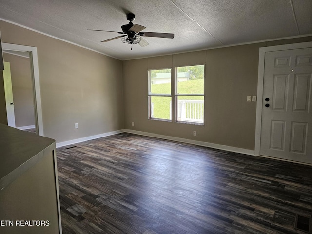 277 Coolidge Rd, La Follette, TN 37766 - unfurnished room featuring ceiling fan, dark wood finished floors, a textured ceiling, and ornamental molding
