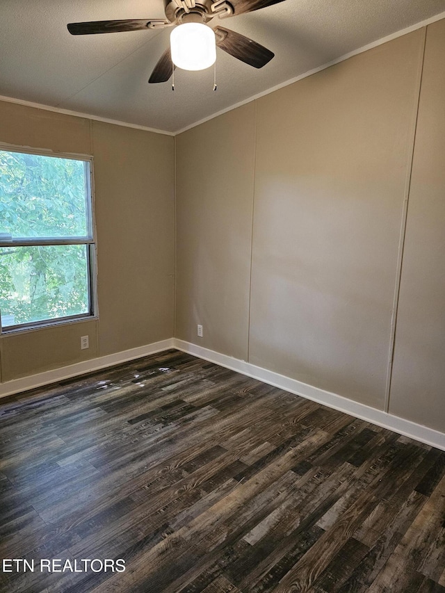277 Coolidge Rd, La Follette, TN 37766 - spare room featuring dark wood-style flooring, crown molding, and a ceiling fan