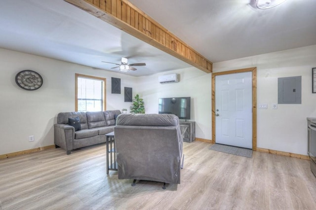 living area with electric panel, a wall mounted AC, a ceiling fan, light wood-style flooring, and baseboards