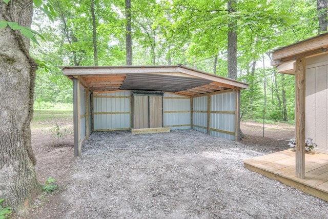 view of outdoor structure with a detached carport
