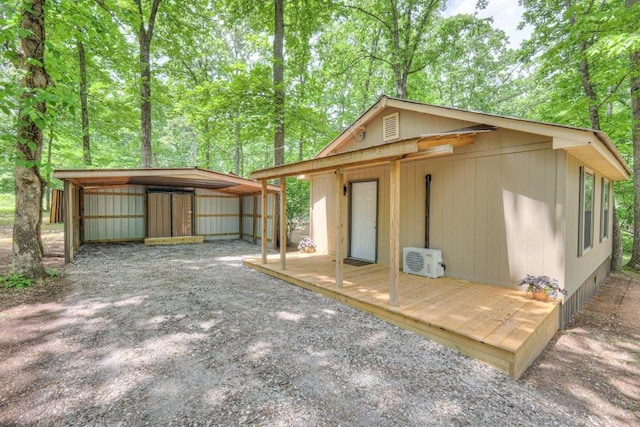 view of outdoor structure with a detached carport and ac unit