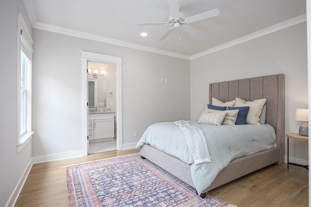 bedroom with light wood finished floors, ornamental molding, multiple windows, recessed lighting, and baseboards