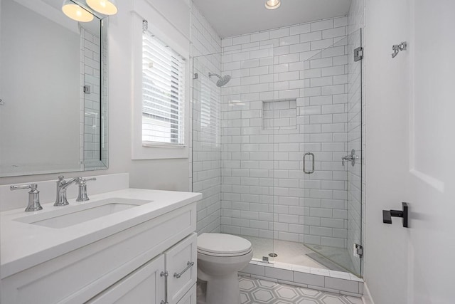 bathroom with a stall shower, toilet, vanity, tile patterned flooring, and recessed lighting