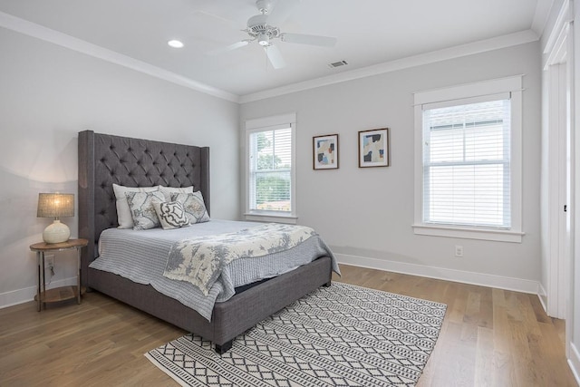 bedroom with light wood-style flooring, baseboards, crown molding, a ceiling fan, and recessed lighting