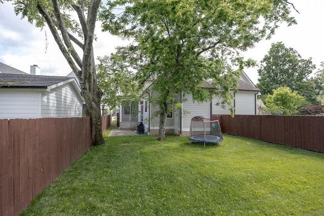 view of yard with a trampoline