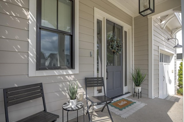 entrance to property featuring a porch