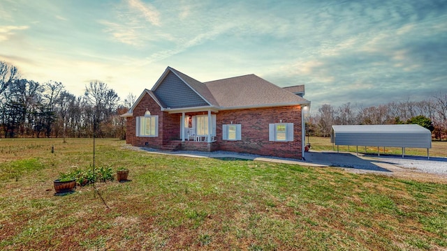 4680 Thick Rd, Chapel Hill, TN 37034 - view of front facade with a detached carport, a front lawn, brick siding, and gravel driveway