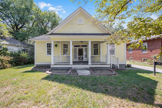 321 Head St, Paris, TN 38242 - view of front of house featuring a porch, a front lawn, a shingled roof, and ceiling fan