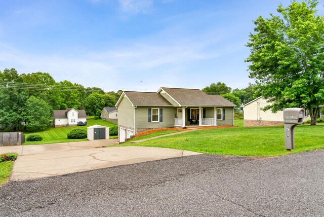 716 Ashwood Dr, Clarksville, TN 37043 - view of front facade featuring covered porch, concrete driveway, a front yard, a garage, and roof with shingles
