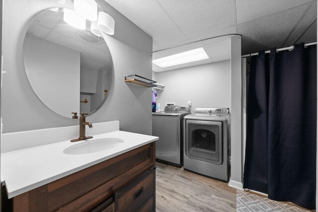 716 Ashwood Dr, Clarksville, TN 37043 - laundry area with independent washer and dryer and light wood-style floors