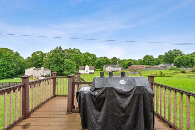 716 Ashwood Dr, Clarksville, TN 37043 - wooden deck featuring grilling area, a yard, and view of scattered trees