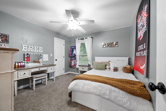 716 Ashwood Dr, Clarksville, TN 37043 - carpeted bedroom featuring a textured ceiling, a ceiling fan, and baseboards
